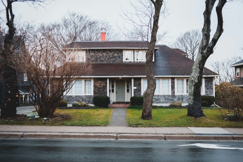 Brick colonial home supported by Front Line