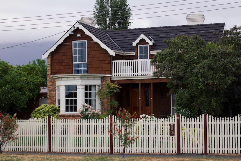 Wood-sided home with property support needs