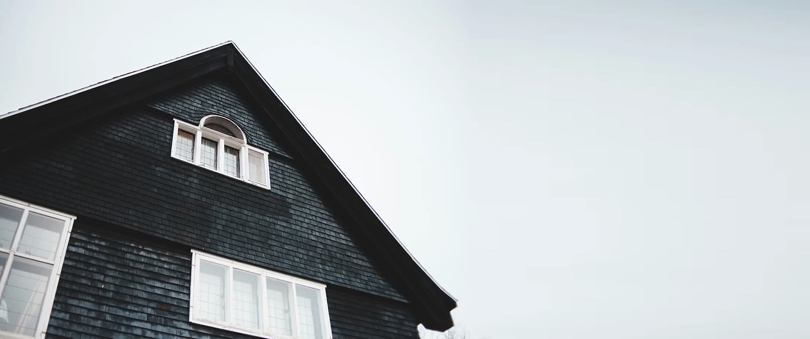 Dark exterior home used for fiduciary real estate process support