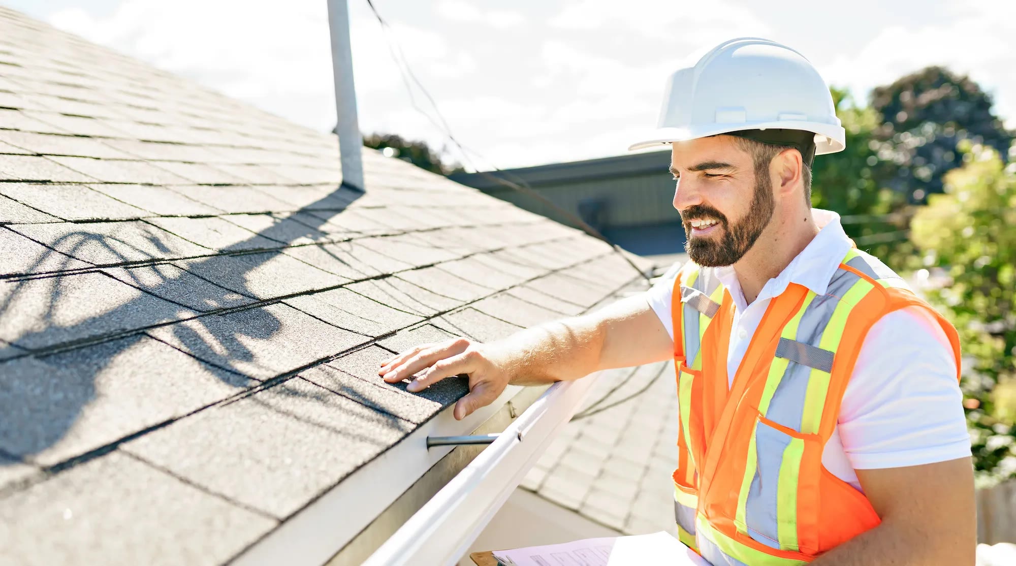 Roof inspector documenting field work